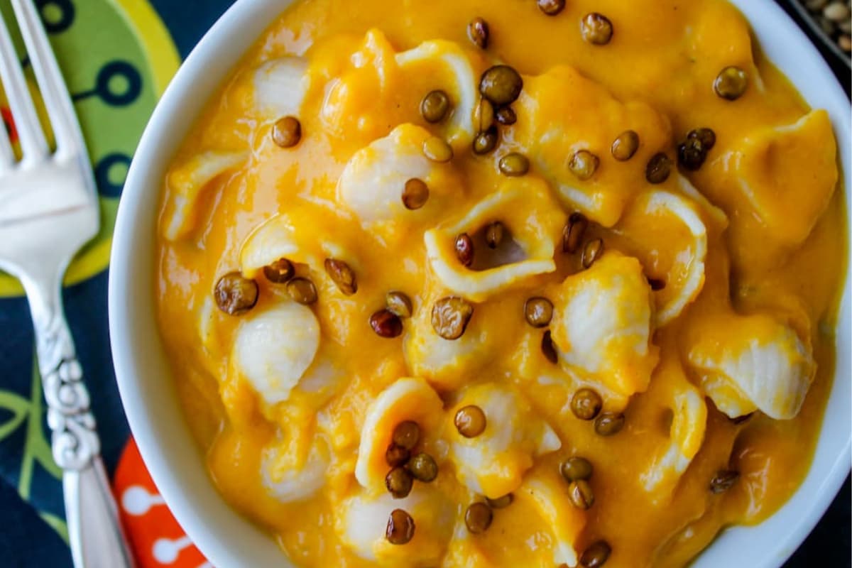 A bowl of Butternut Squash Mac and Cheese with Crispy Lentils.