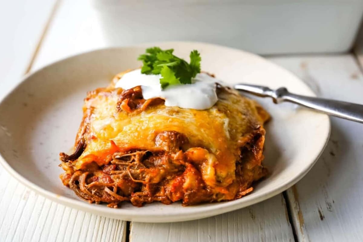 A plate of Stacked Beef Enchiladas.