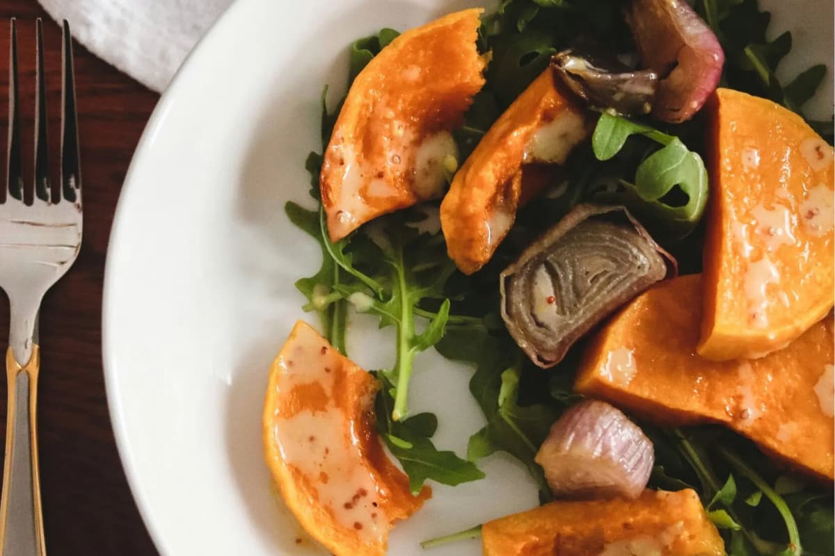 A plate of Butternut Squash and Arugula Salad.