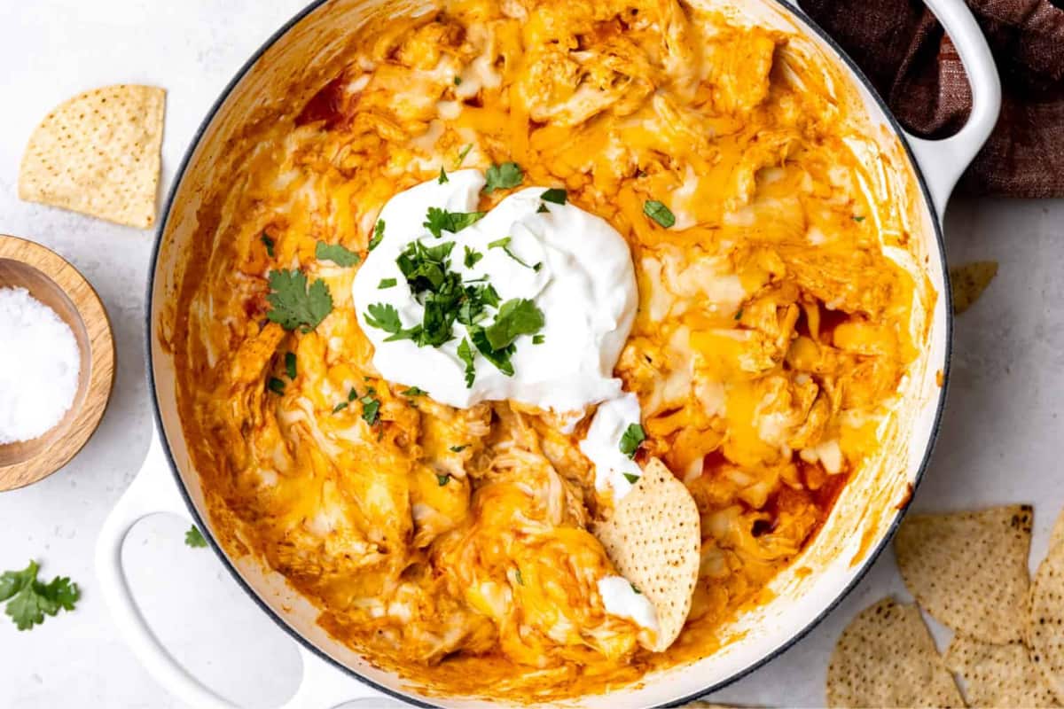 A dish of Cheesy Chicken Enchilada Dip.