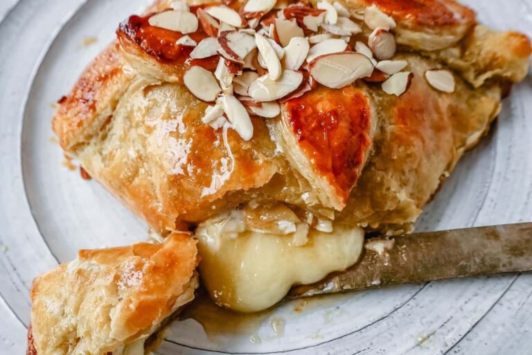 A plate of Honey Almond Puff Pastry Wrapped Brie.
