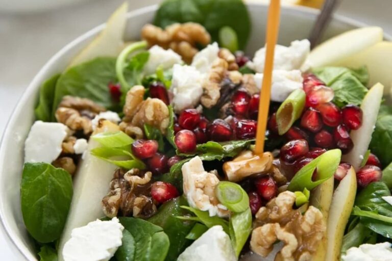 A plate of Spinach Pear and Feta Salad.
