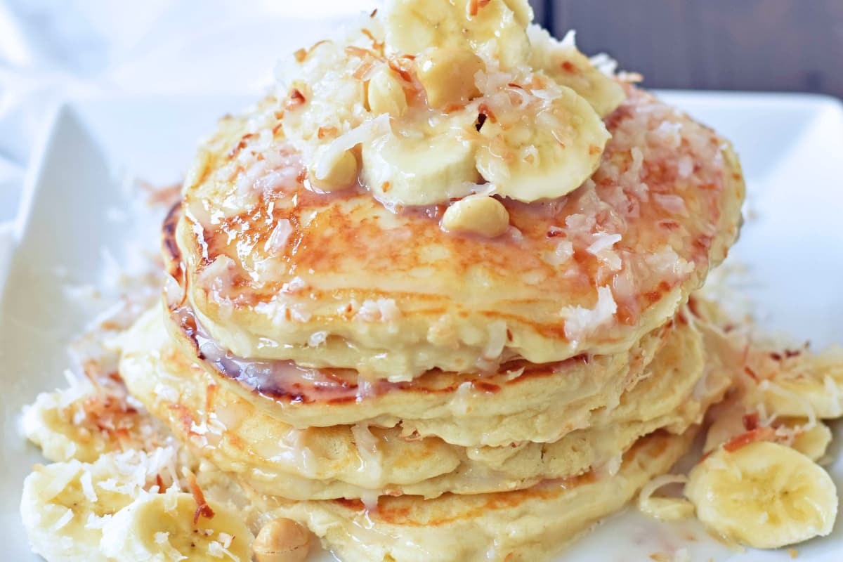 A plate of Coconut Macadamia Pancakes.