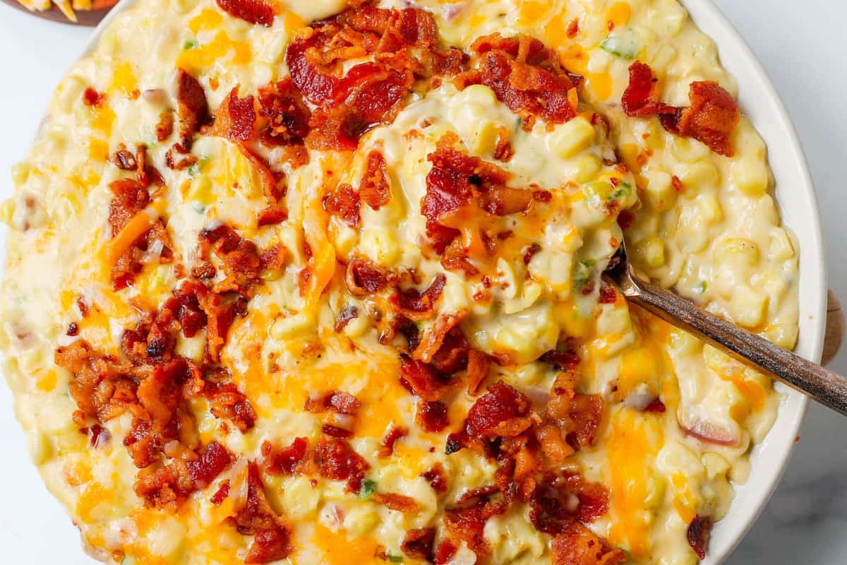 A bowl of Cheesy Creamed Corn with Bacon.