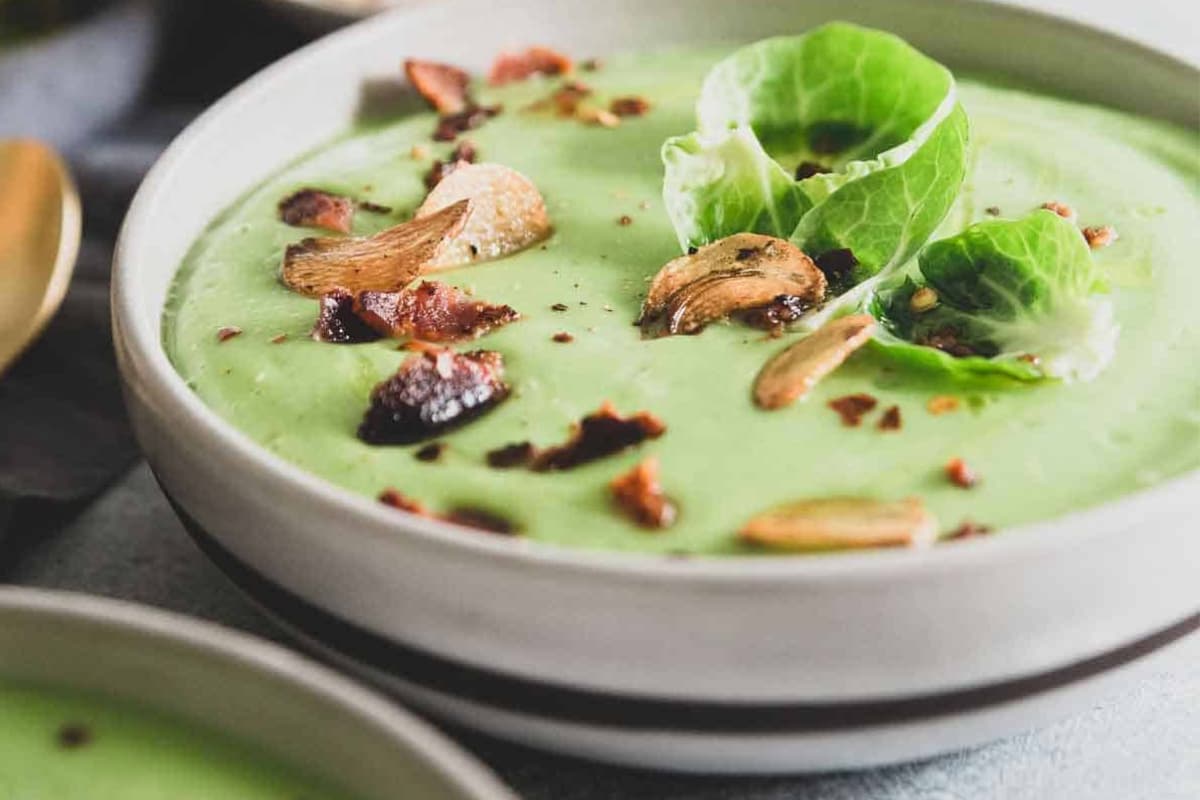A bowl of Creamy Garlic Brussels Sprout Soup.