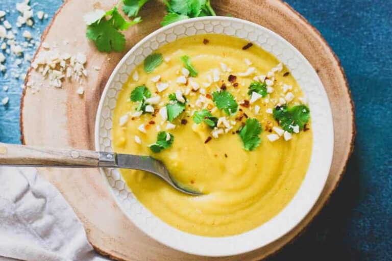 A bowl of Creamy Delicata Squash and Pumpkin Soup.
