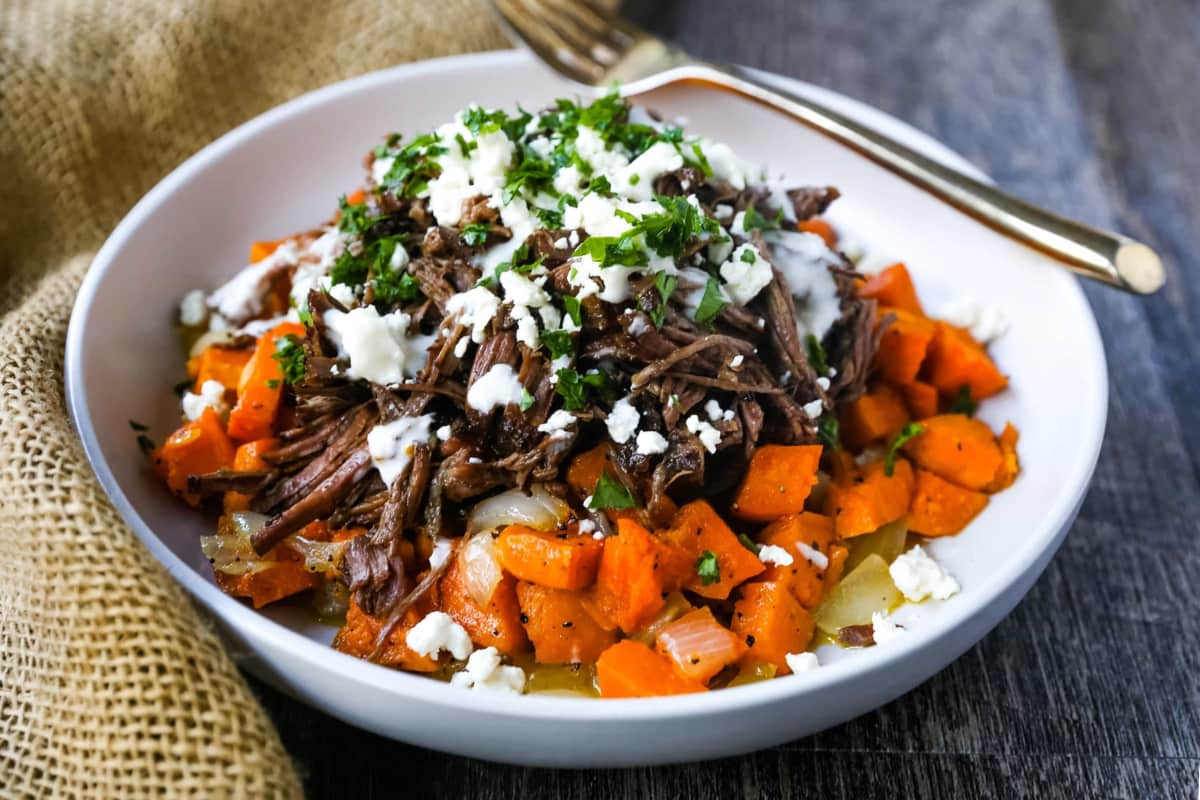 A bowl of Braised Beef and Sweet Potato Hash.