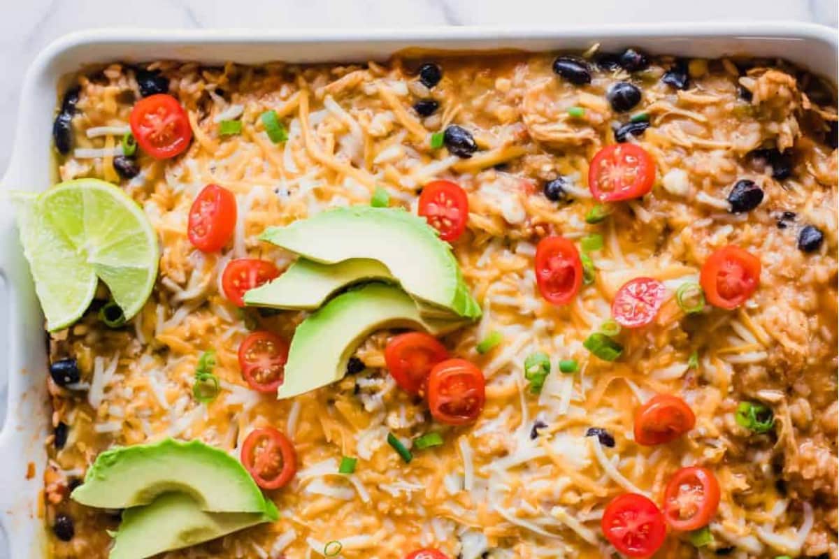 A dish of Chicken Enchilada Rice Casserole with Olives.