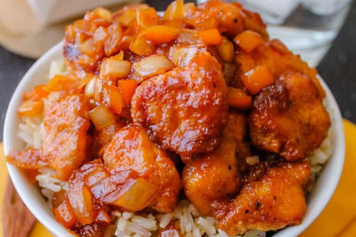 A bowl of Gluten Free Sweet and Sour Chicken.