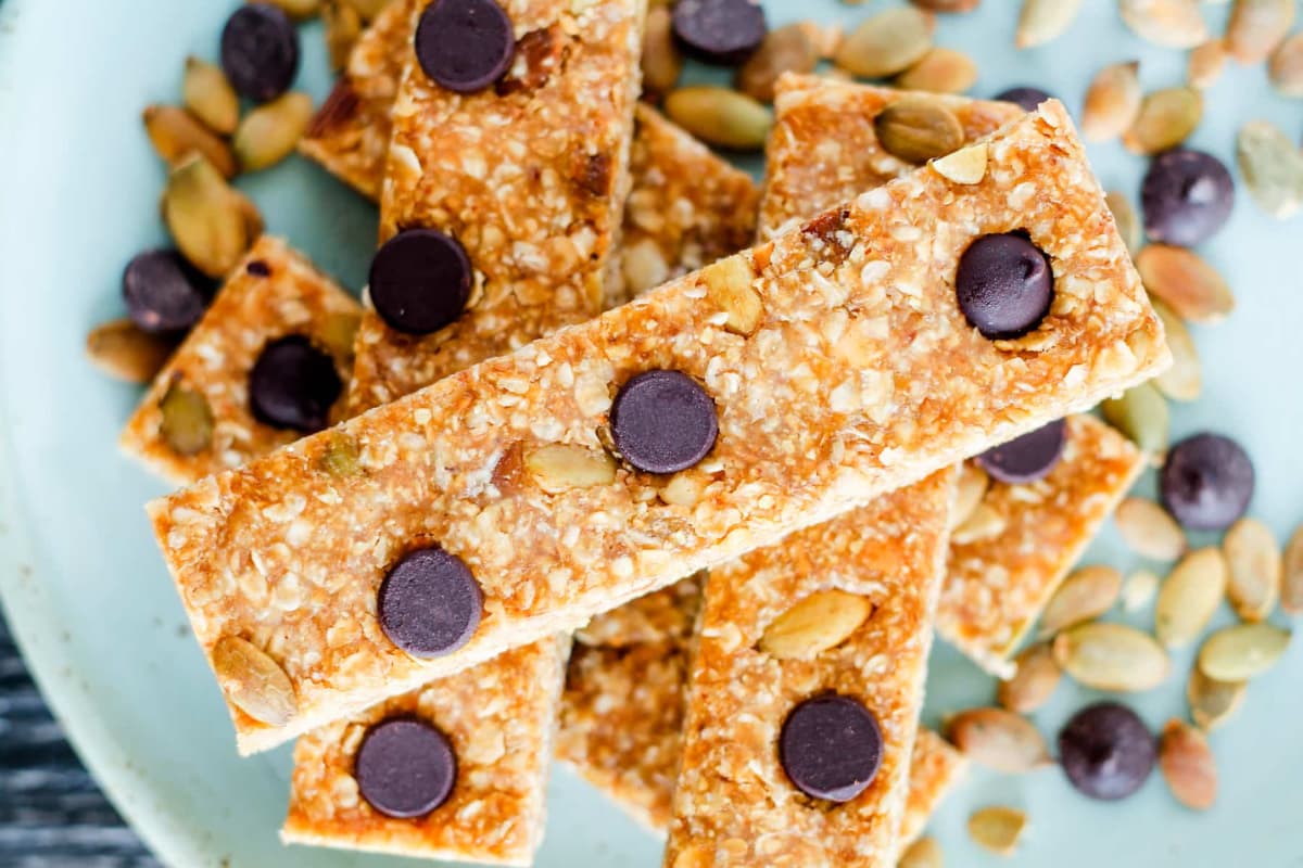 A plate of Chewy No-Bake Energy Bars with Pumpkin Seeds.