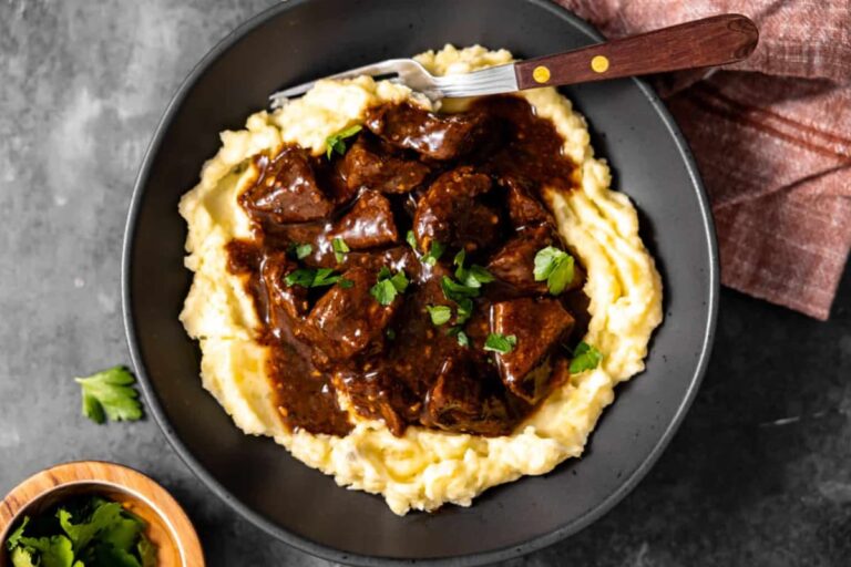 A plate of beef tips and gravy.