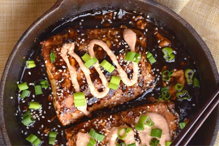 A plate of Teriyaki Salmon with Sriracha Greek Yogurt Sauce.