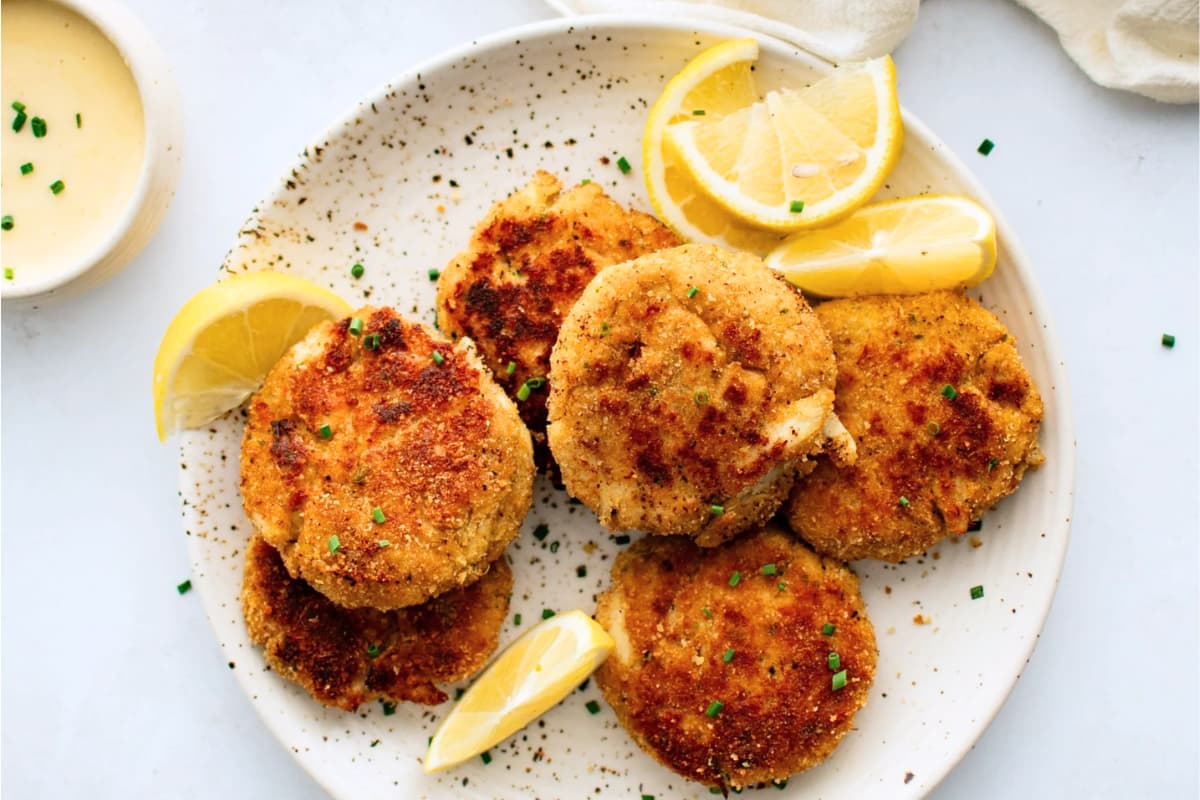 A plate of Crab Cakes with Honey Dijon Dipping Sauce.