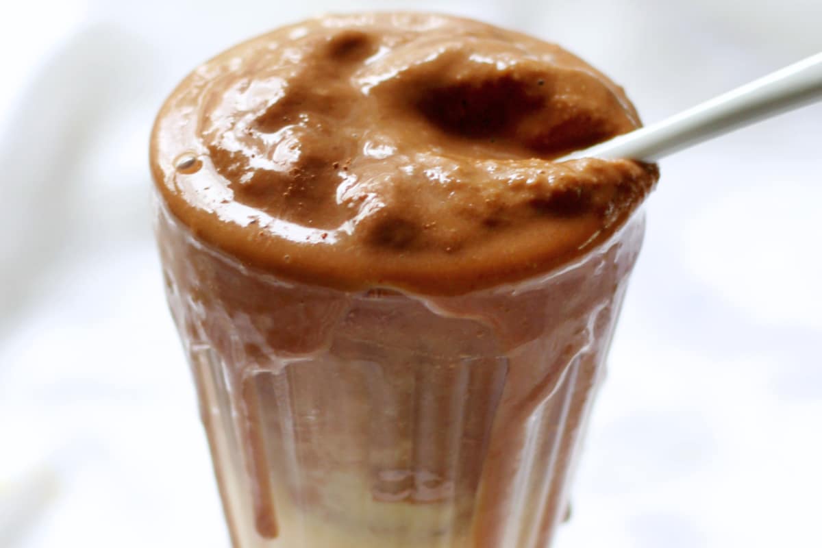 A glass of Peanut Butternut Squash Protein Smoothie.