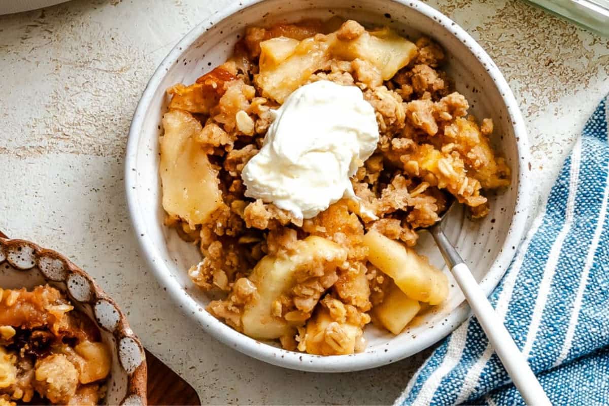 A bowl of Slow Cooker Apple Crisp.