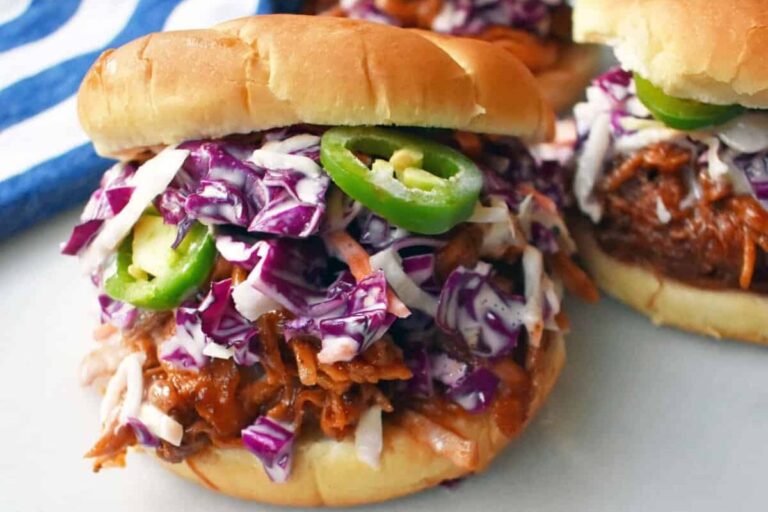 A plate of Slow Cooker Dr. Pepper Pulled Pork Sandwich.