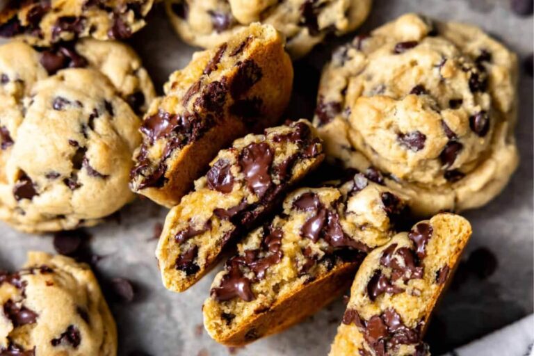 A plate of thick chocolate chip cookies.