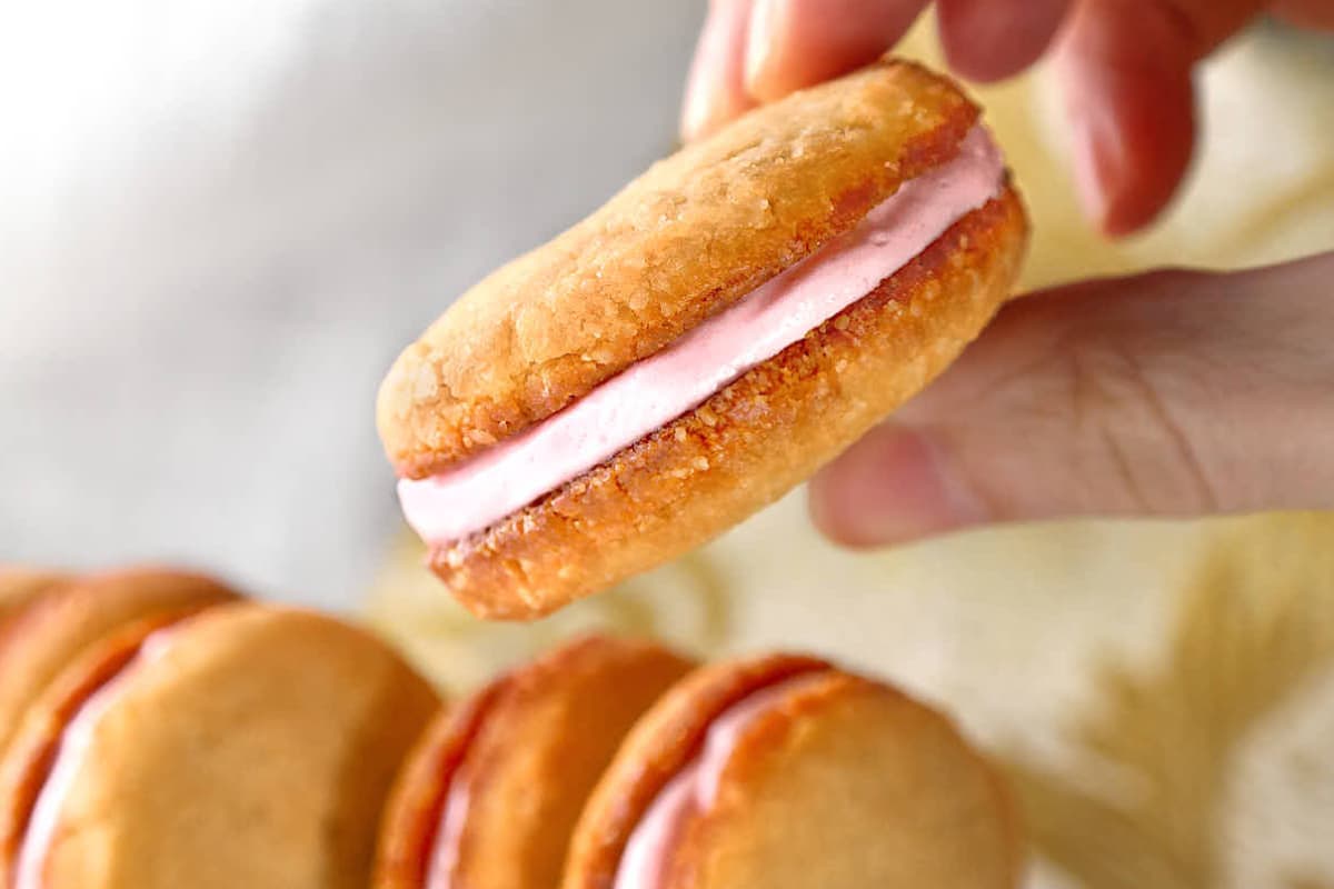 A plate of Strawberry Cream Sandwich Cookies.
