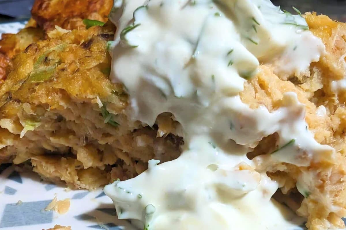 A plate of Classic Salmon Loaf With Dijon Dill Sauce.