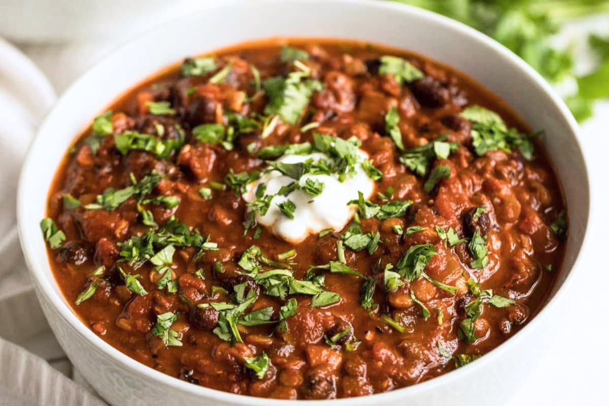 A bowl of Smoky Lentil Black Bean Chili.
