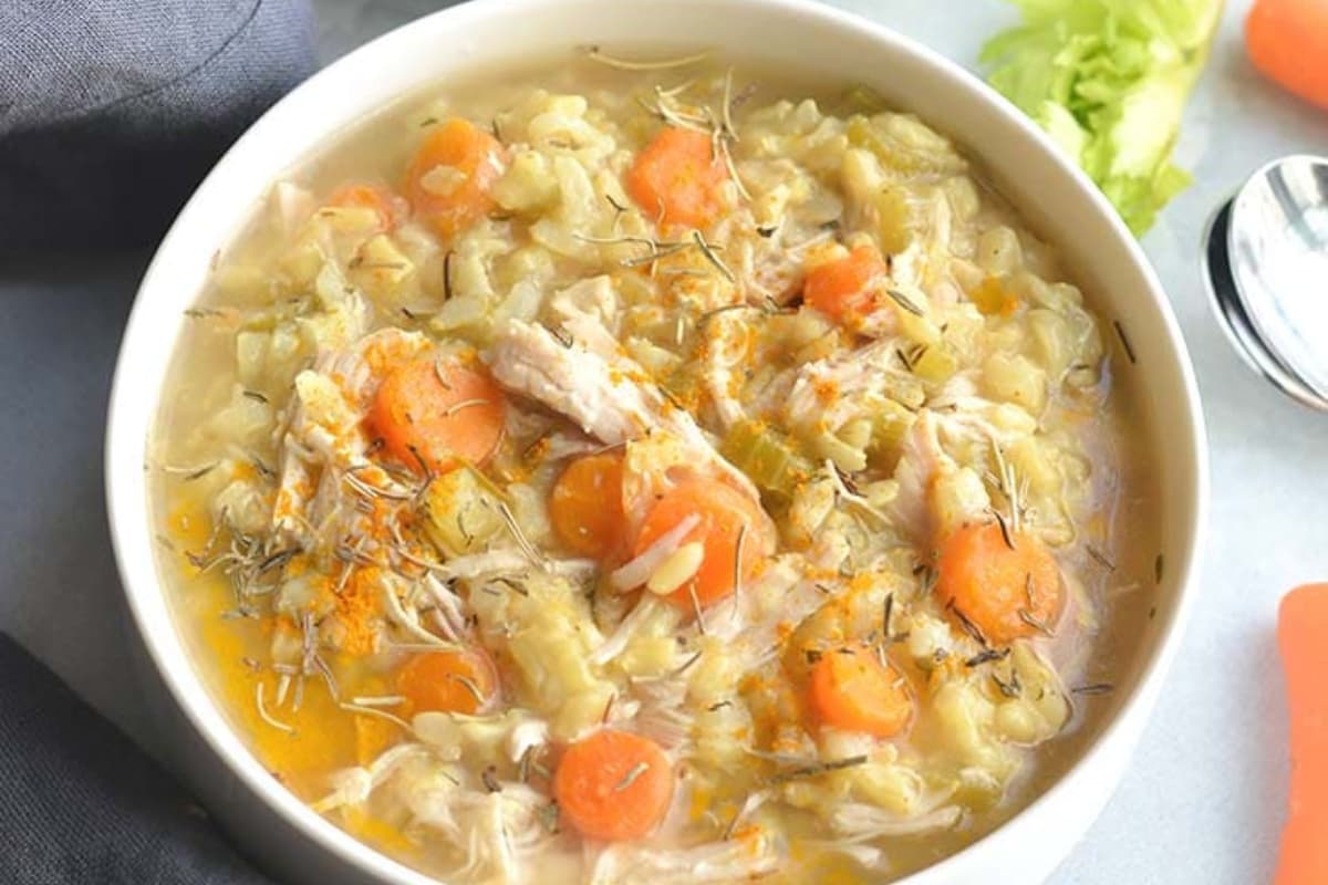 bowl of Instant Pot Turmeric Chicken Rice Soup.