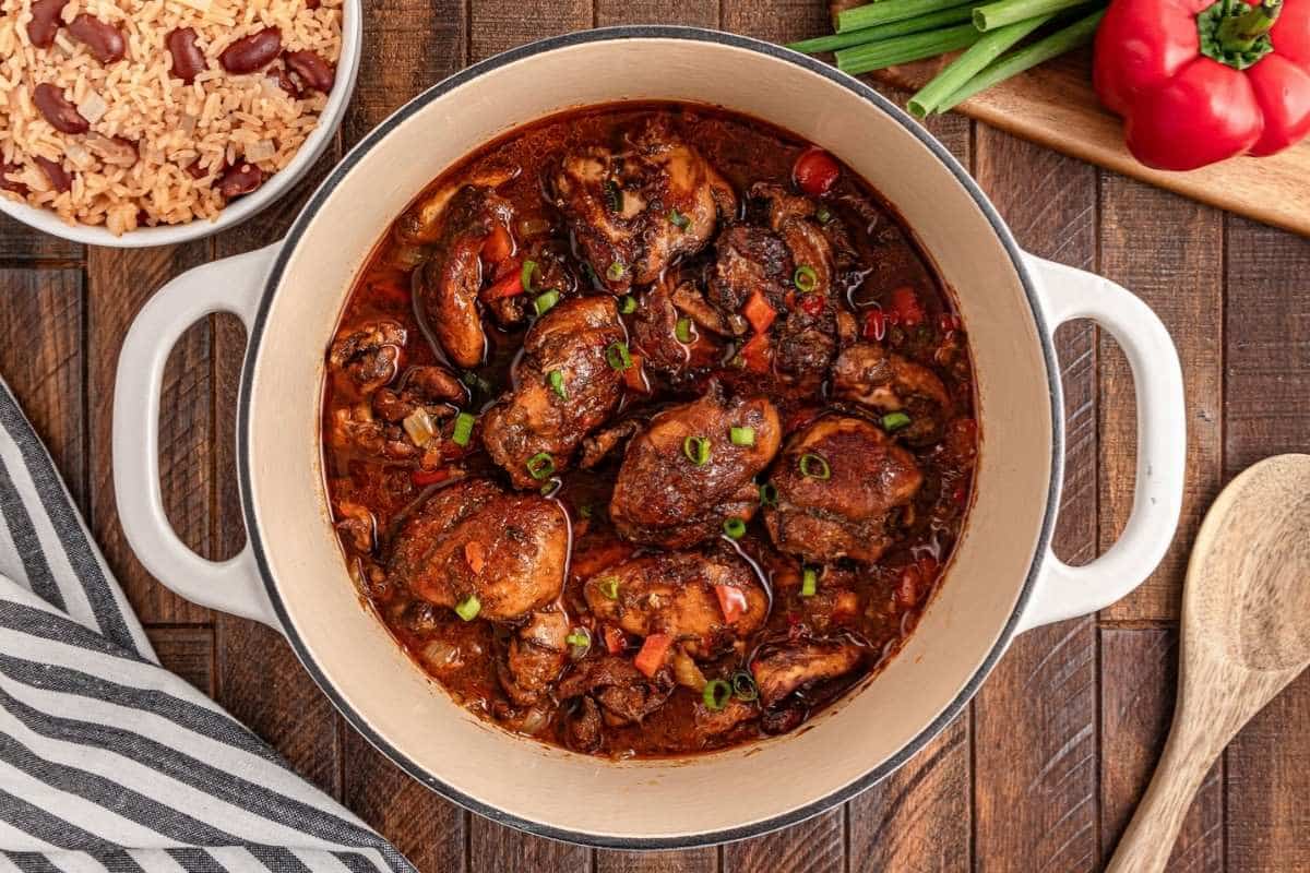 A pot of brown stew chicken.