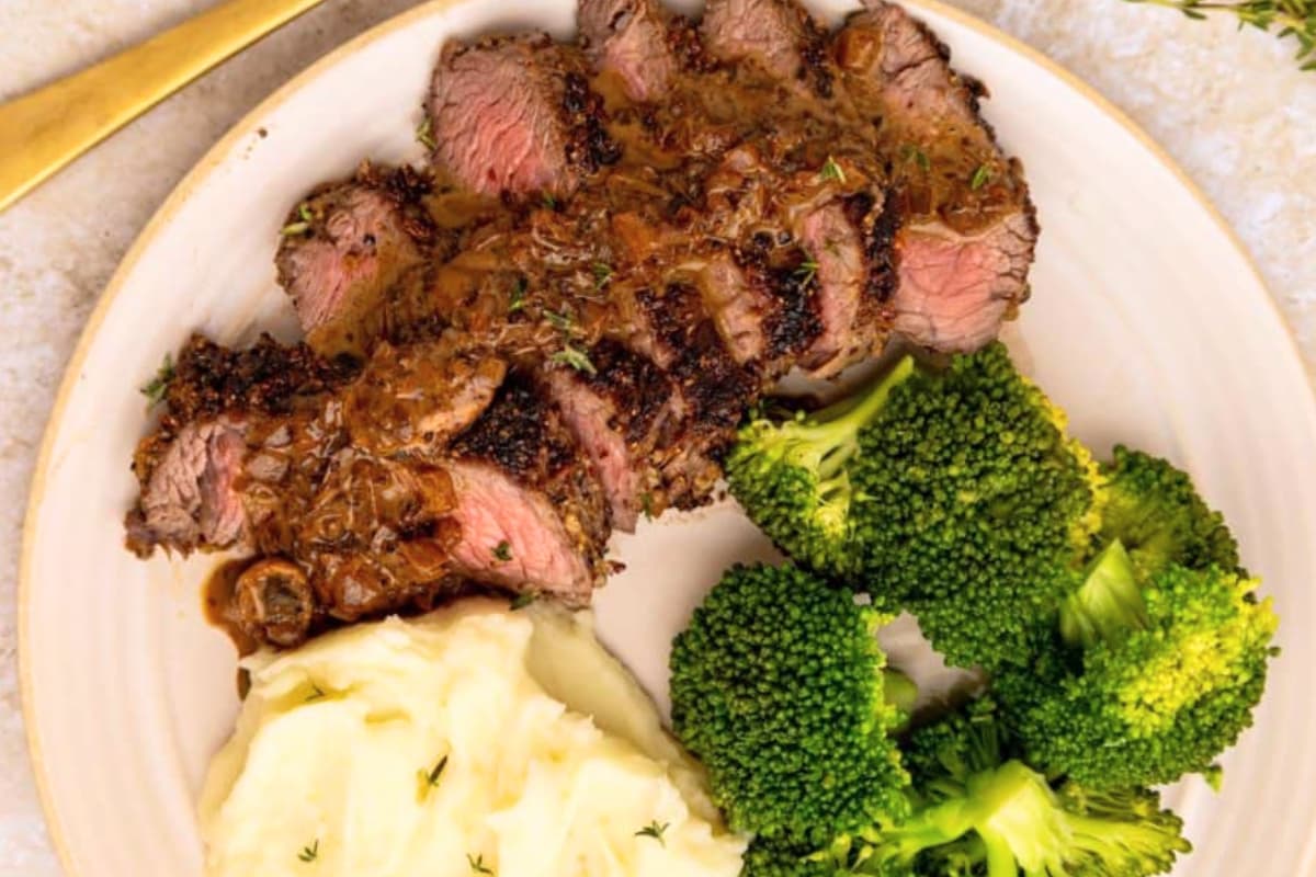 A plate of Steak with Mushroom Sauce.
