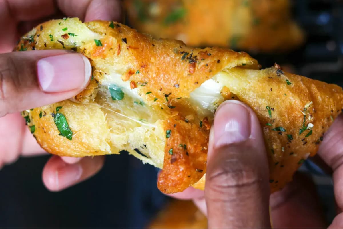 A dish of Easy Air Fryer Cheesy Garlic Crescent Rolls.