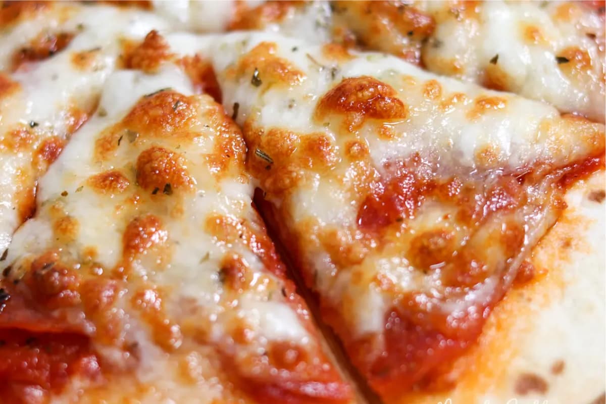 A plate of Air Fryer Tortilla Pizza.