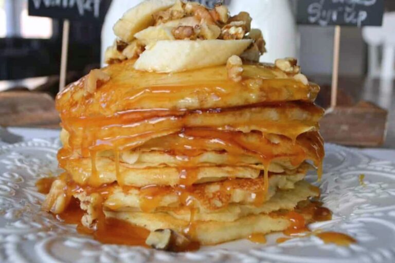 A plate of Goldie’s Banana Walnut Buttermilk Pancakes.