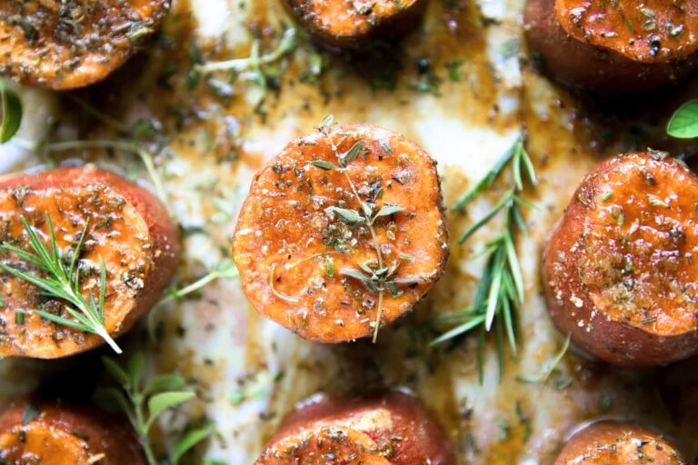 A plate of Butter Roasted Sweet Potatoes with Brown Sugar.