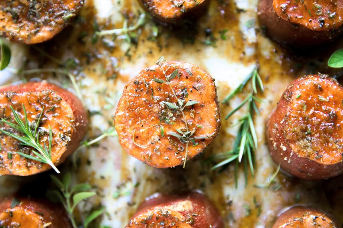 A plate of Butter Roasted Sweet Potatoes with Brown Sugar.