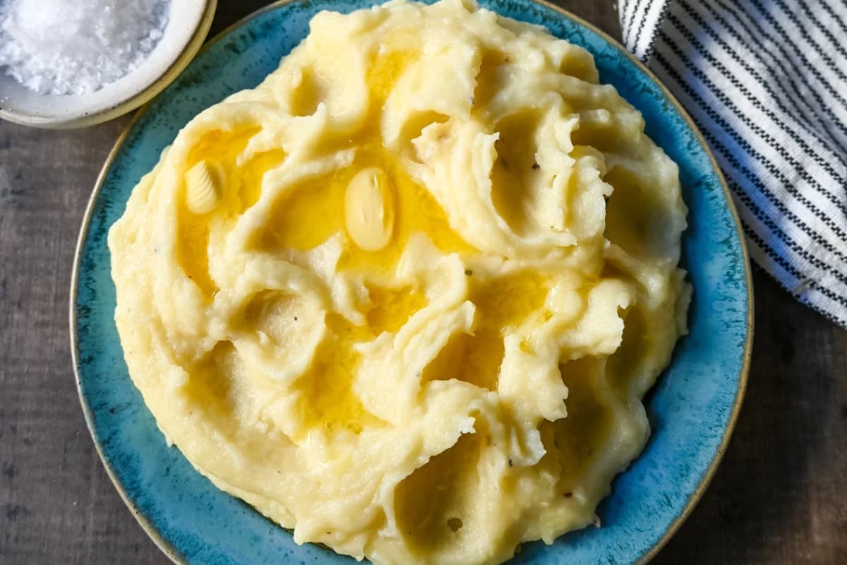 A bowl of Parmesan Roasted Garlic Mashed Potatoes.