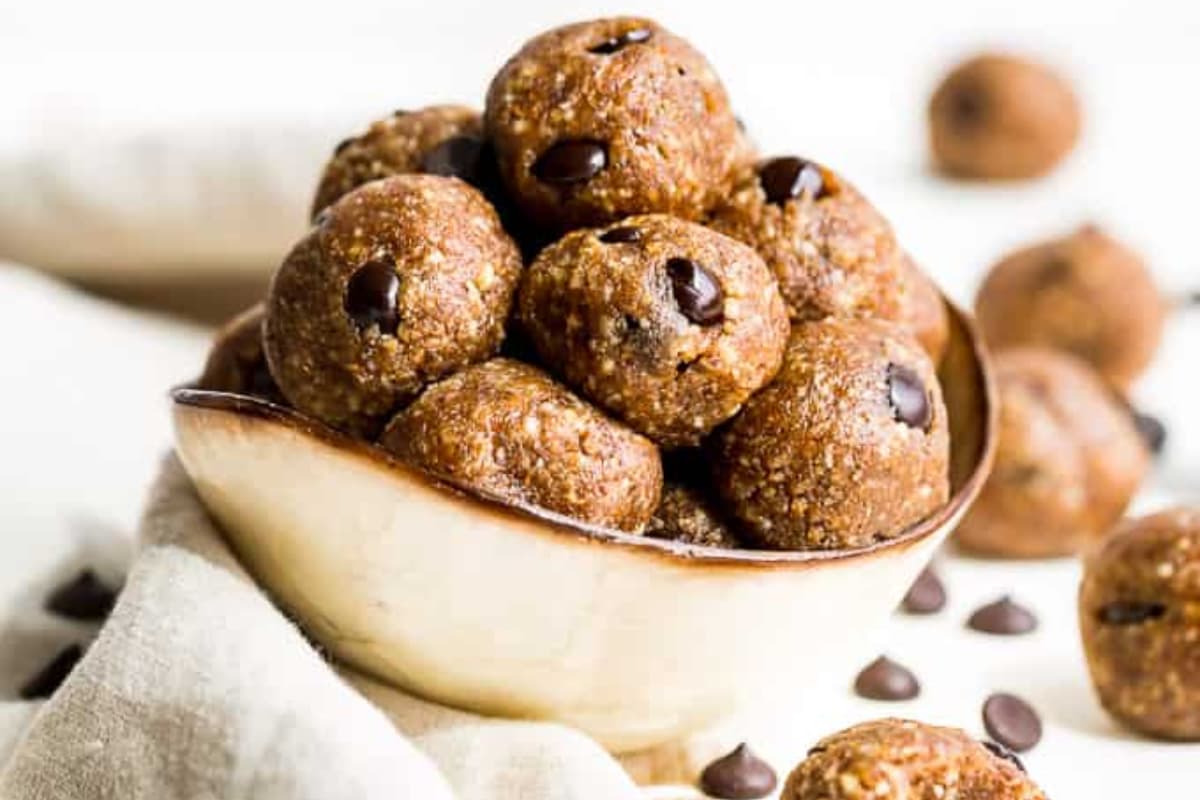 A bowl of Coconut Flax Chocolate Chip Energy Balls.