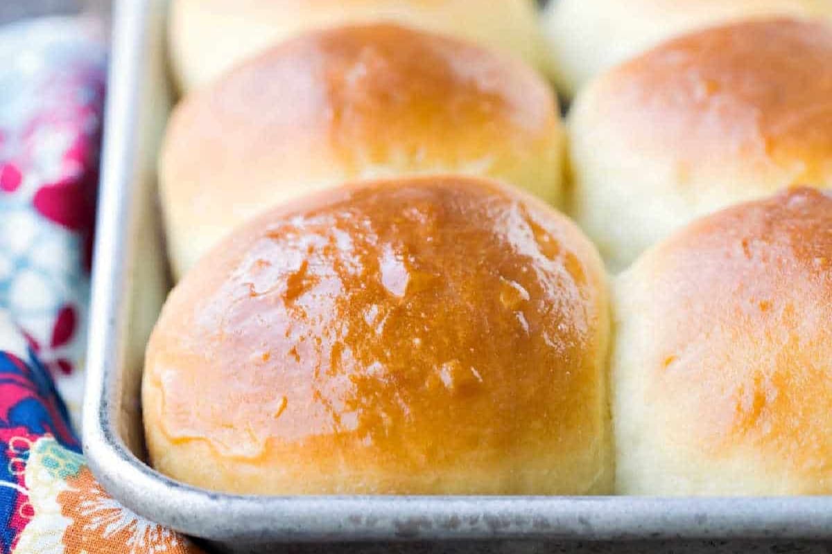A tray of Whip up your own Hawaiian Rolls at home with this easy, from-scratch recipe. Soft, fluffy, and way better than store-bought!.