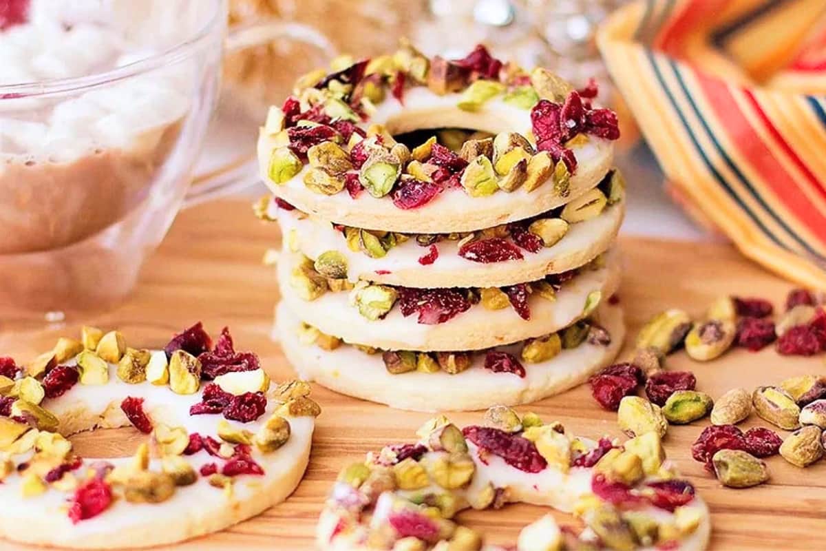 A plate of Cranberry Pistachio Wreath Cookies.