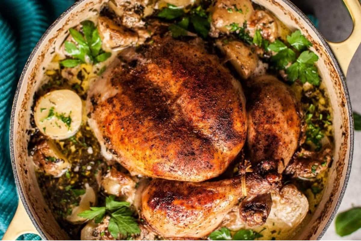 A dish of Creamy Lemon and Herb Pot Roasted Chicken.