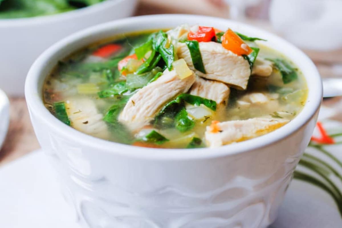 A bowl of Chicken Vegetable Soup with Spinach.