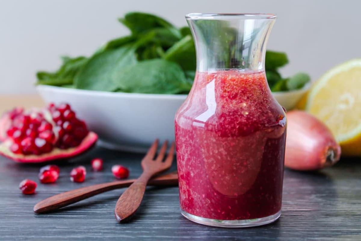 A jar of Pomegranate Vinaigrette Dressing.