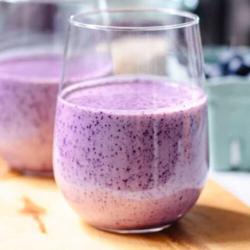 A glass of blueberry breakfast smoothie.