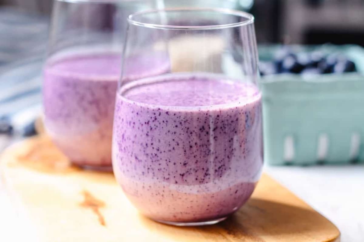 A glass of blueberry breakfast smoothie.