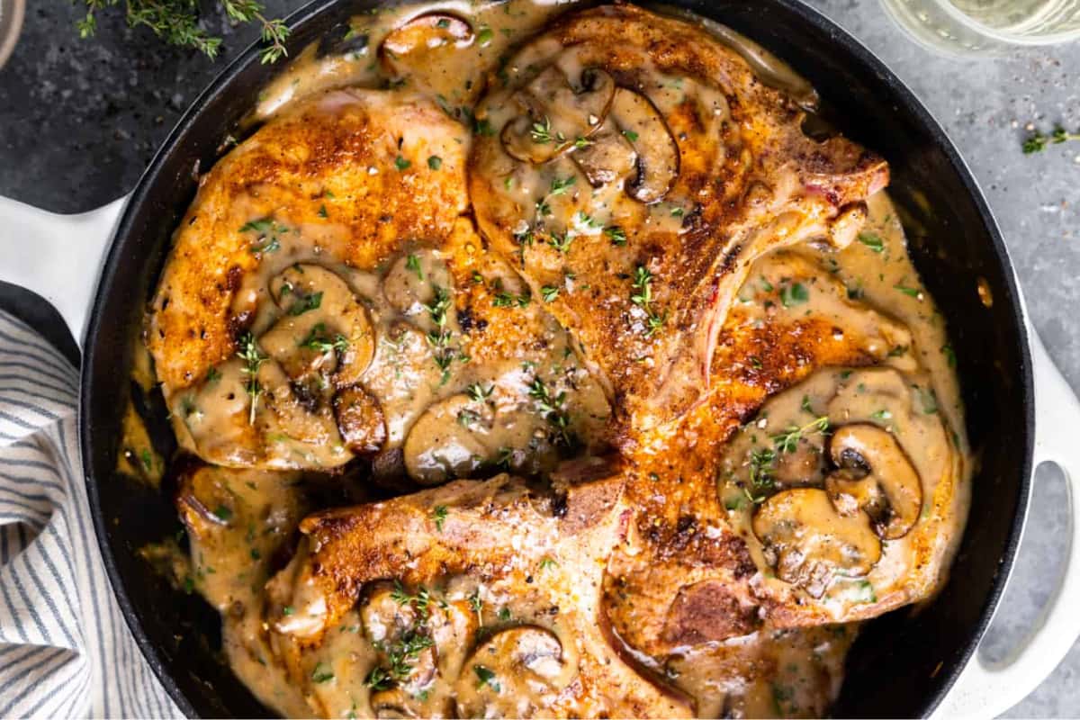 A dish of Pork Chops with Cream of Mushroom Soup.