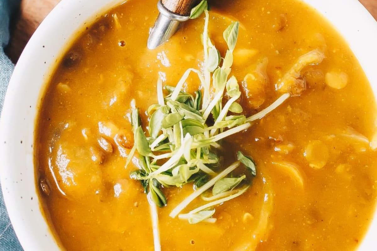 A bowl of Curry Butternut Squash and Lentil Soup.