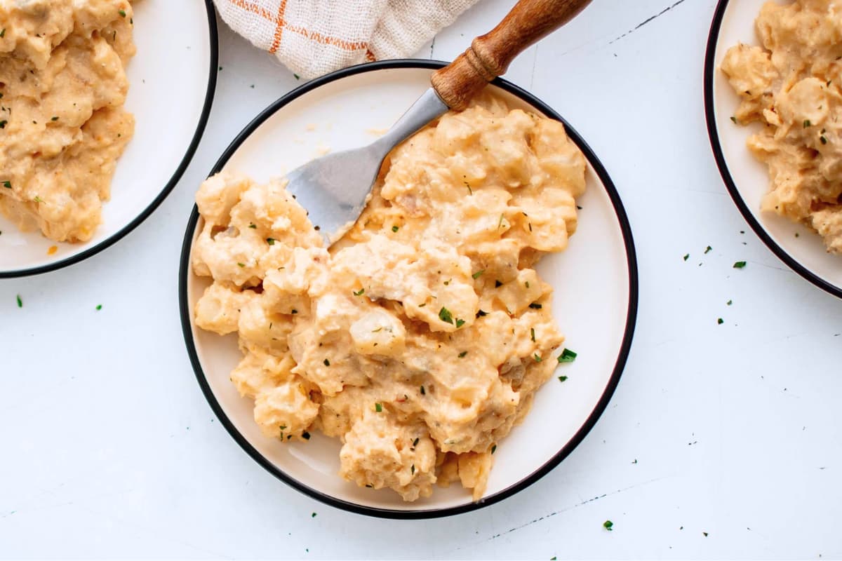 A plate of Crockpot Cheesy Potatoes.