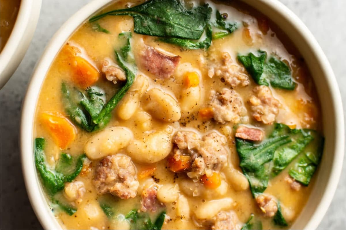 A bowl Italian Sausage White Bean Soup.