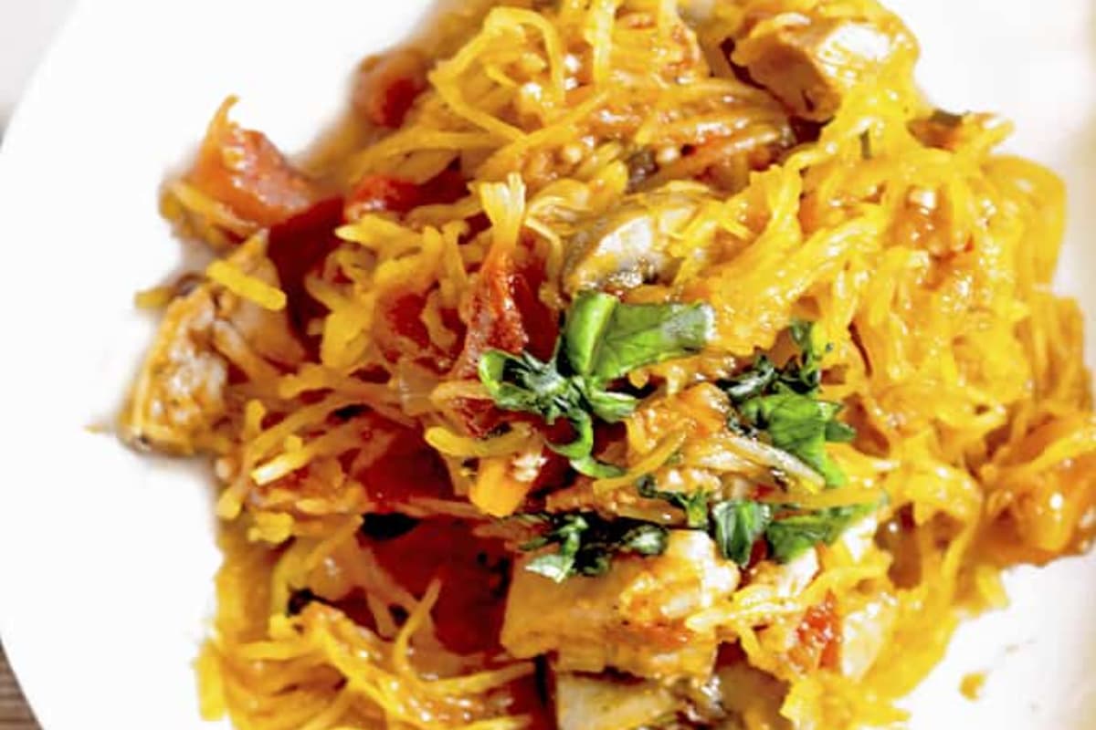 A plate of Roasted Spaghetti Squash with Chicken Cacciatore.