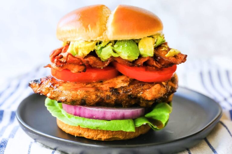 A plate of Avocado Bacon Grilled Chicken Sandwich.
