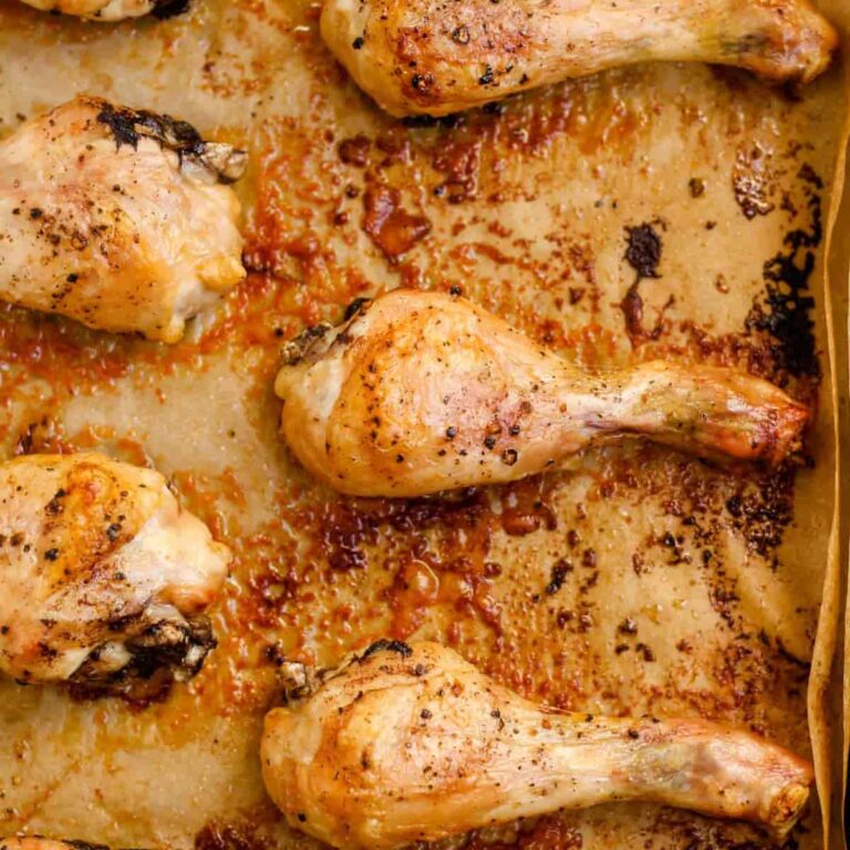 Overhead image of baked chicken drumsticks.