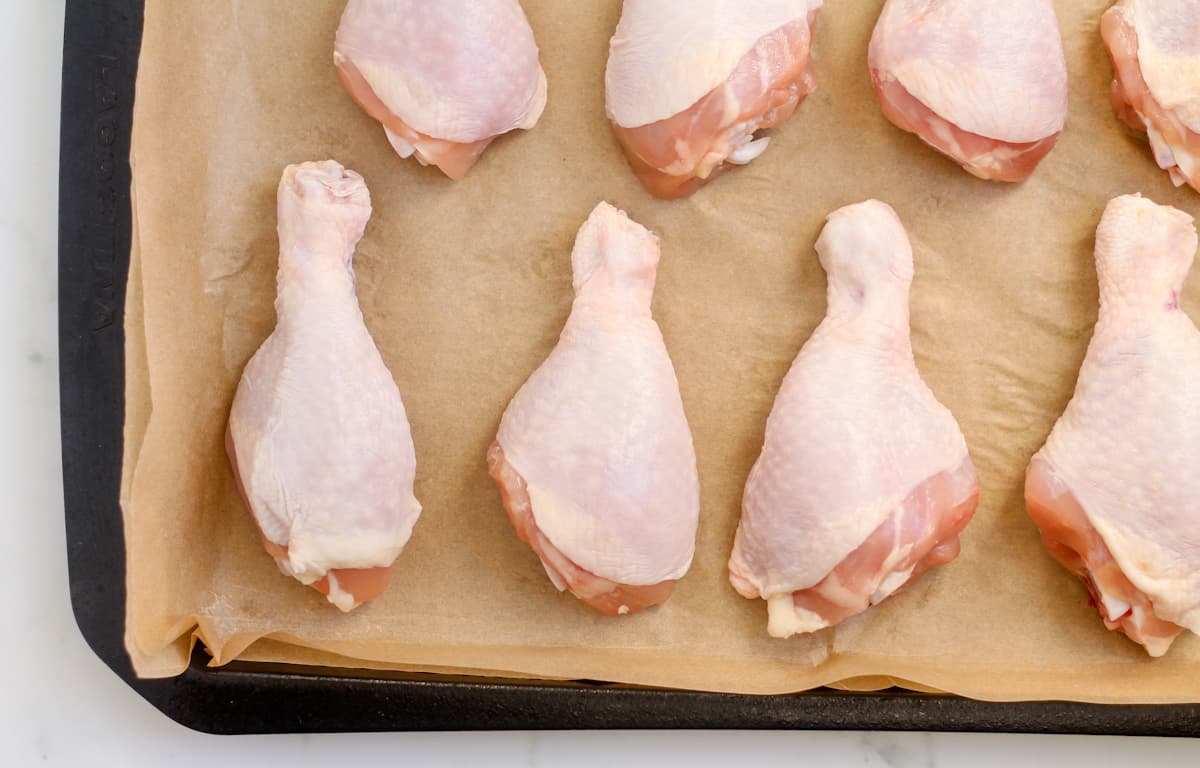 Chicken on a baking sheet.