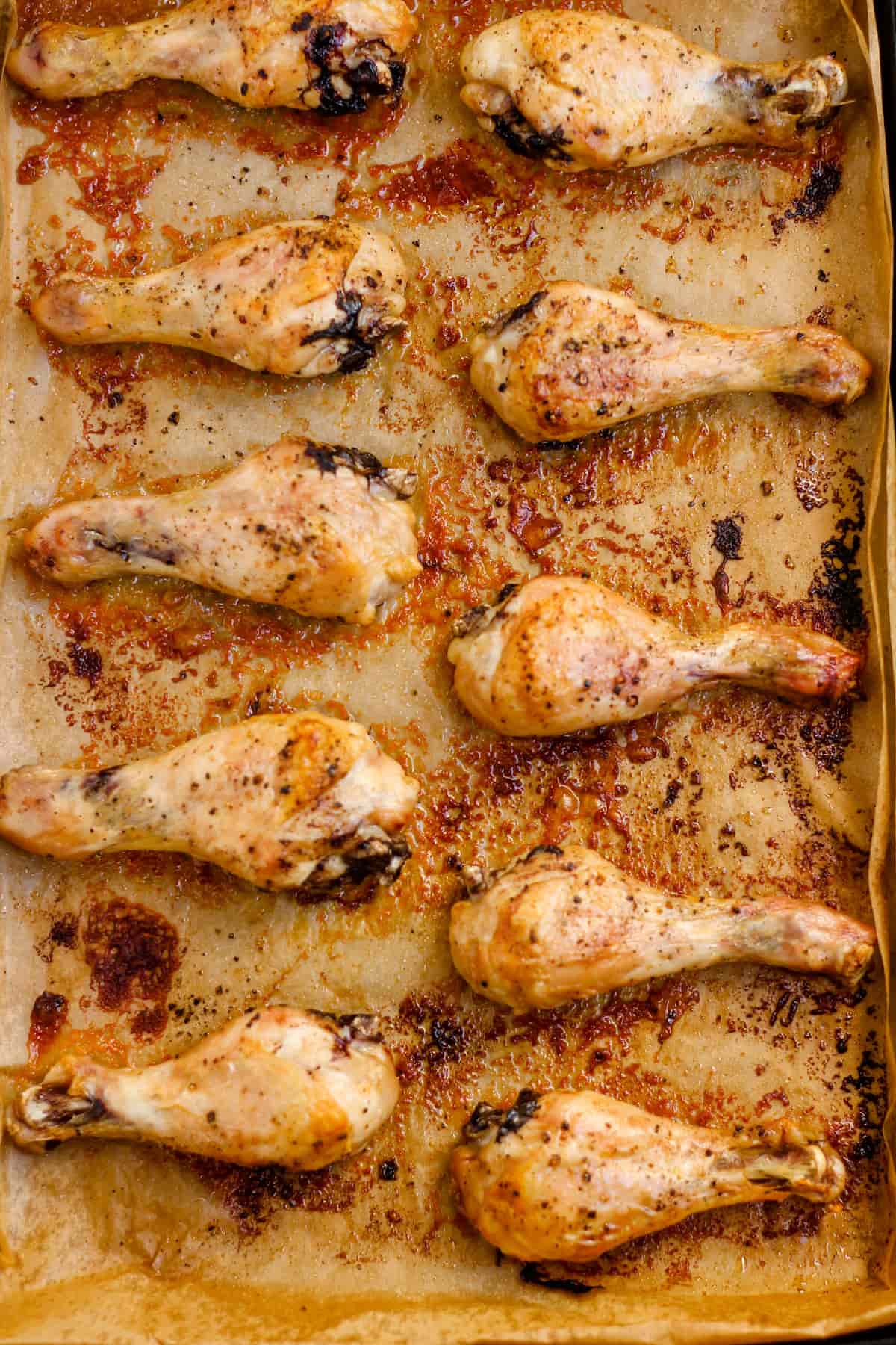 Overhead image of baked chicken drumsticks.